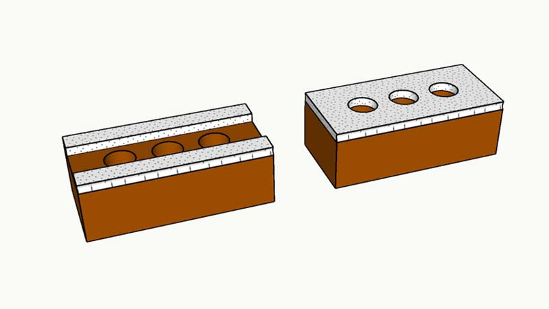 Image of brick with face shell mortar bedding at left and full mortar bedding at right