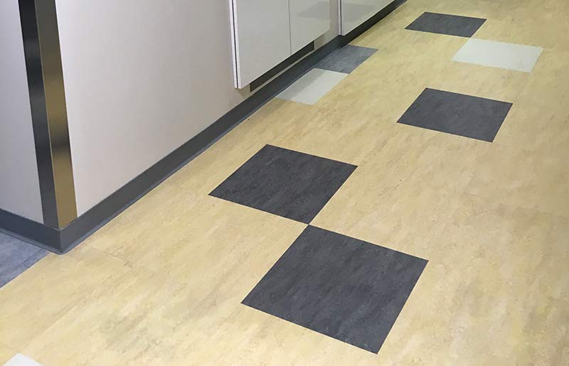 Photo of resilient floor tiles and resilient wall base