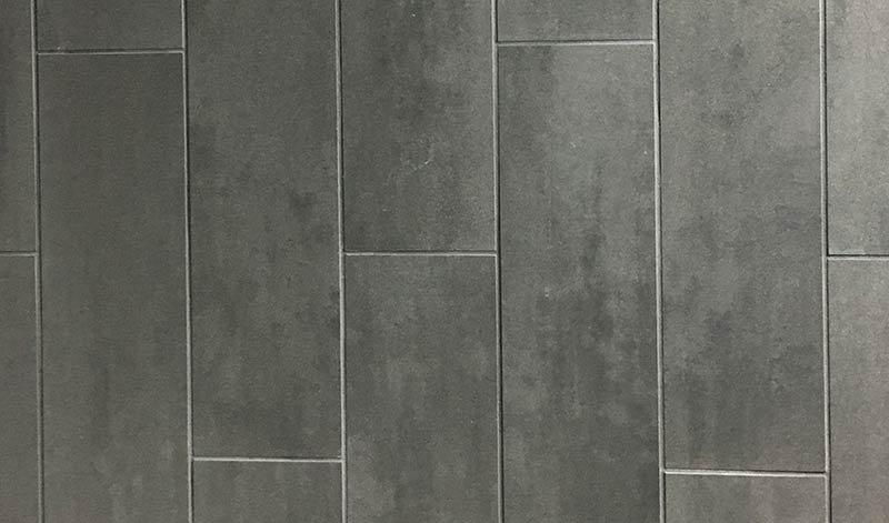 Photo of dark tile grout with dark tile