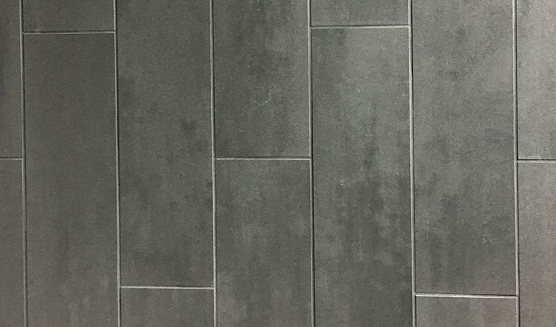 Photo of dark tile grout with dark tile